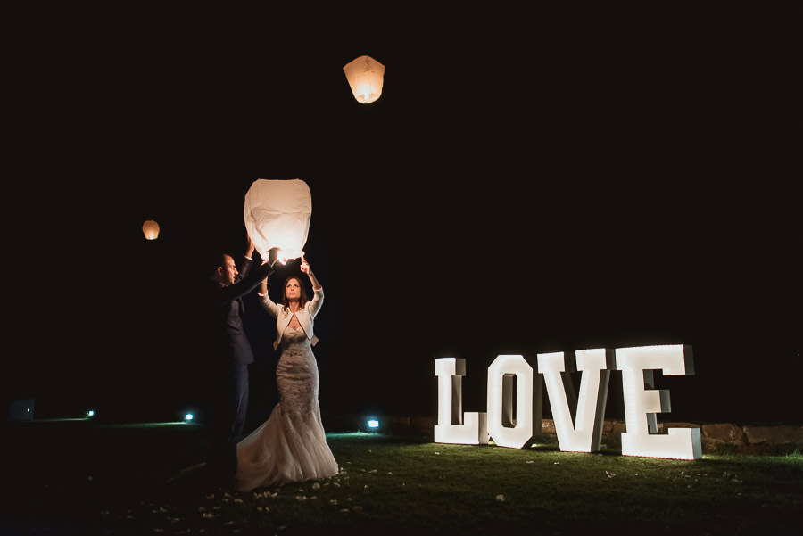 italian style outdoor wedding ceremony, firing wedding lantern