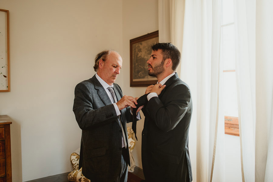 destination wedding in italy groom getting ready photography