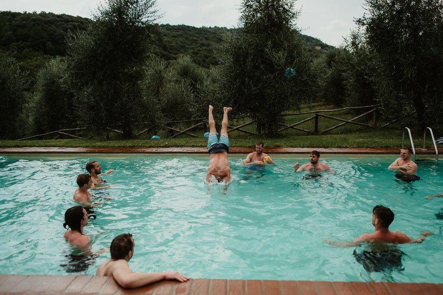 Villa Petrolo wedding in Tuscany groom groomsmen fun pool