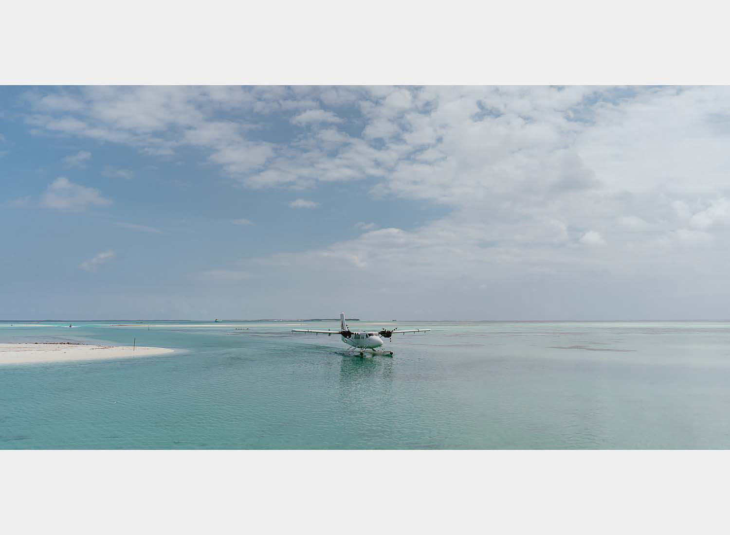 wedding photographer in maldives anniversary trip private sandbank affairs canoe dugout