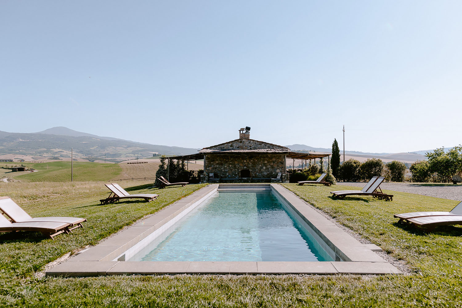 Wedding Inspiration Tuscan Rolling Hills locanda in tuscany view by the pool