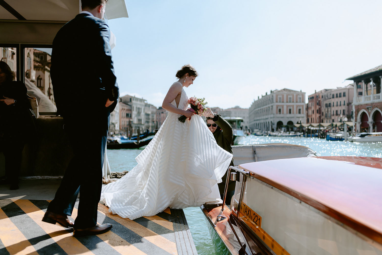 wedding photographer venice elopement photography bride water taxi ride