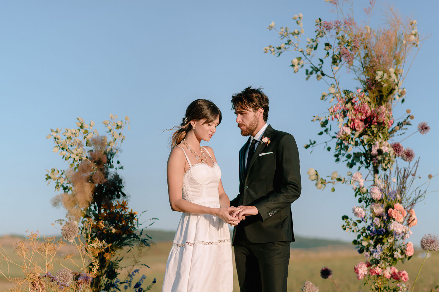 editorial Wedding Inspiration Tuscan Rolling Hills ceremony setup puscina flowers and eventset