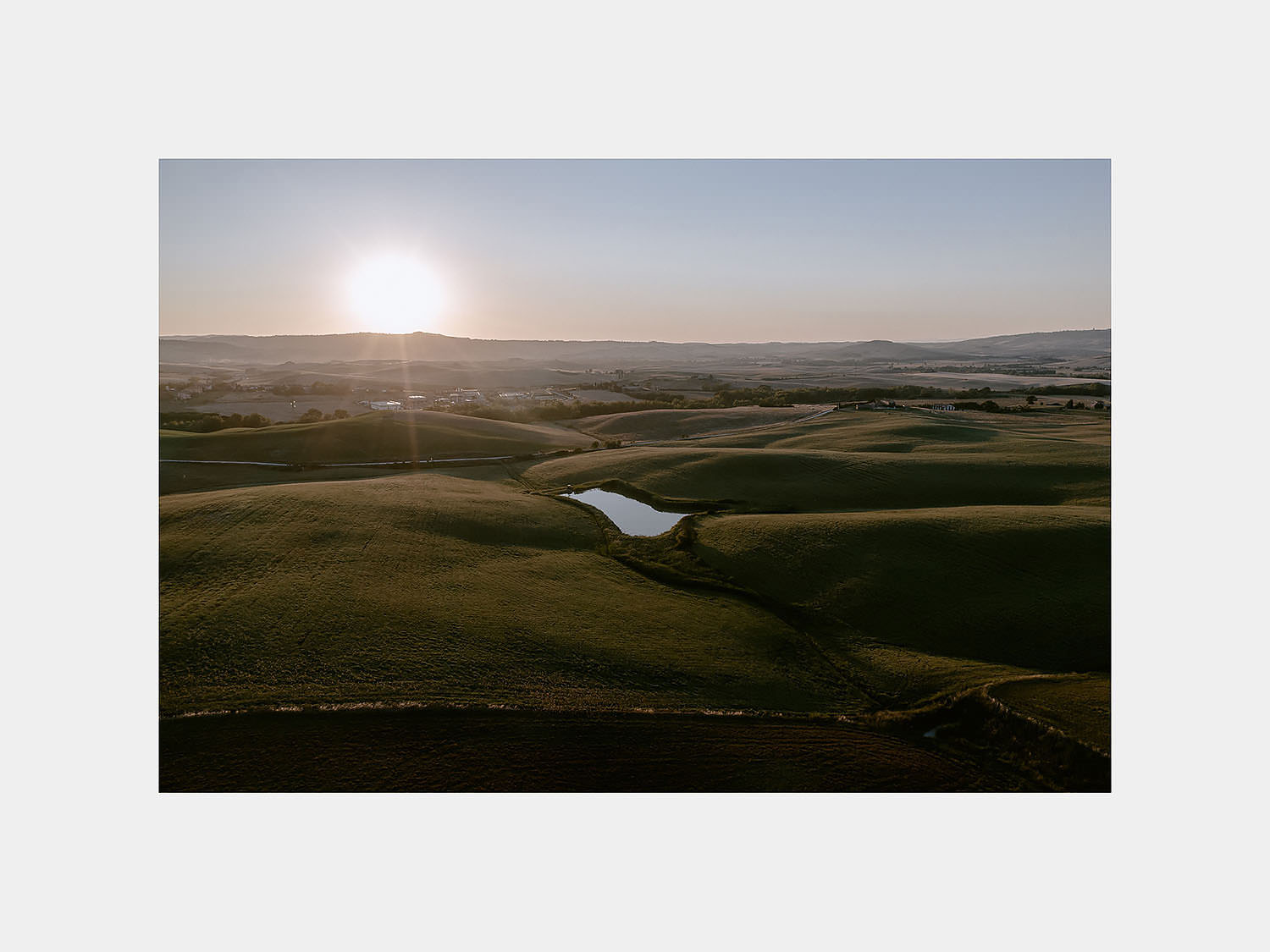 intimate Wedding Inspiration Tuscan Rolling Hills val d orcia locanda in tuscany view at sunset by drone