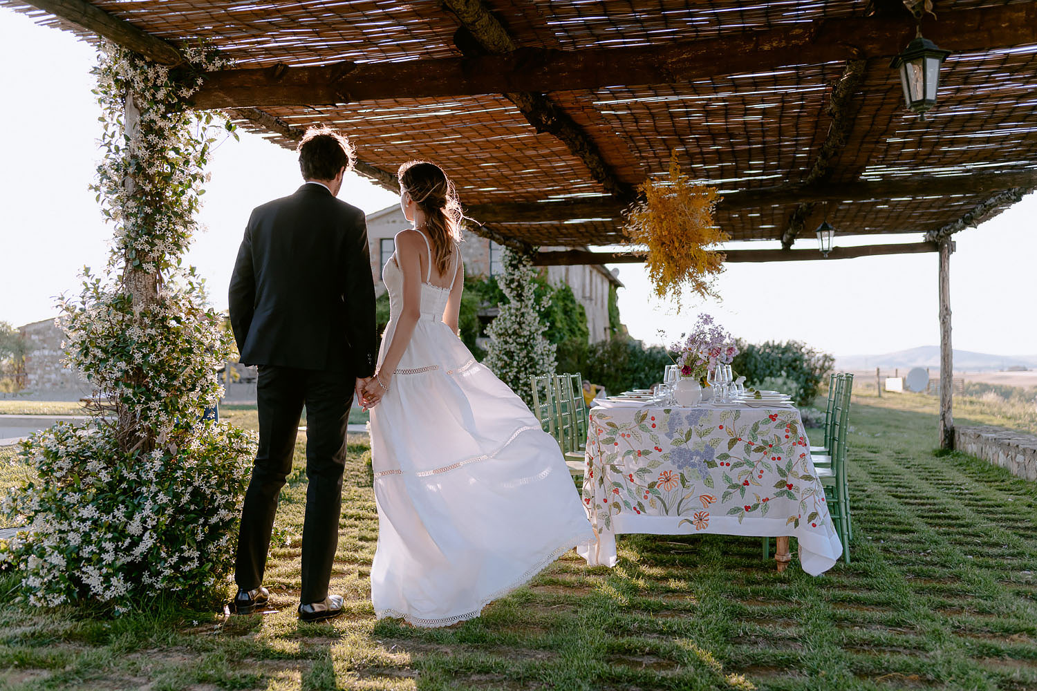 editorial intimate Wedding Inspiration Tuscan Rolling Hills bride and groom portrait at dinnet table place