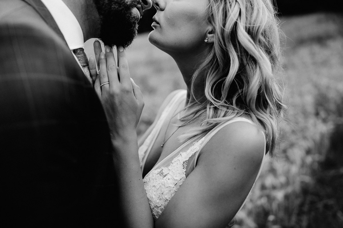 intimate bridal couple first kiss